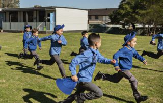 Children running in the field